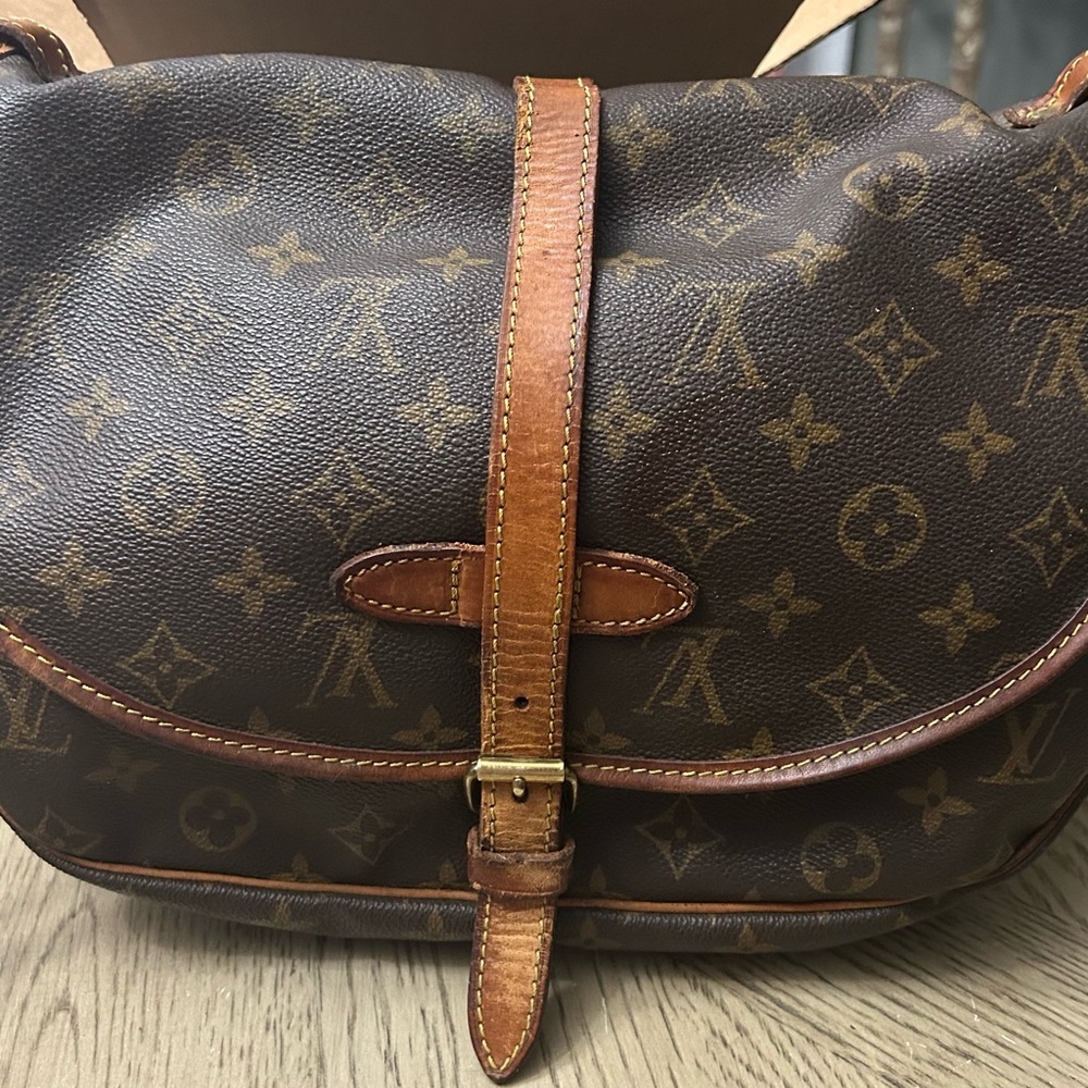 Louis Vuitton messenger saddle bag.